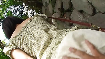 Adorable Asian brunette rubbing her soaking wet cunt