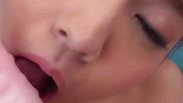 Nude beauty fondles Asian fake penises in her wet vagina